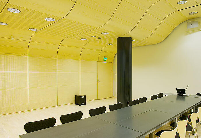 Curved ceiling panels in the back of the library.
