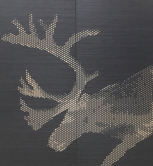 Puucomp deer perforated on veneer panel.